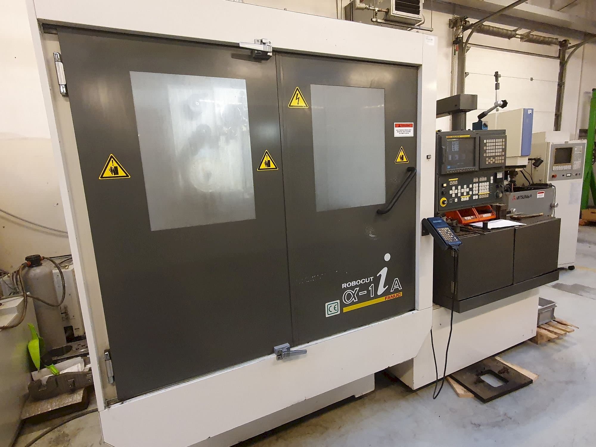 Koneen FANUC Robocut Alpha-1iA etunäkymä