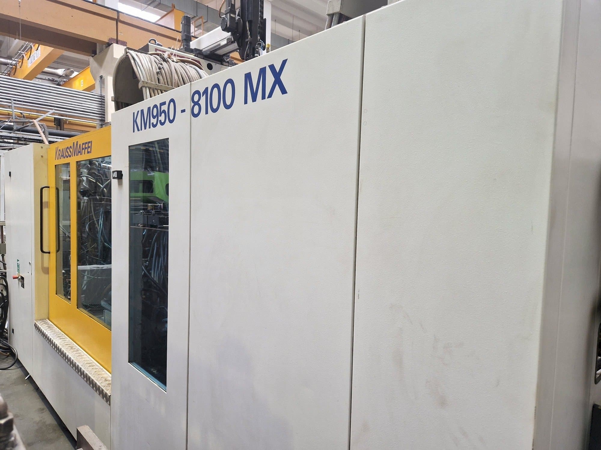 Koneen Krauss Maffei 950-8100 MX etunäkymä