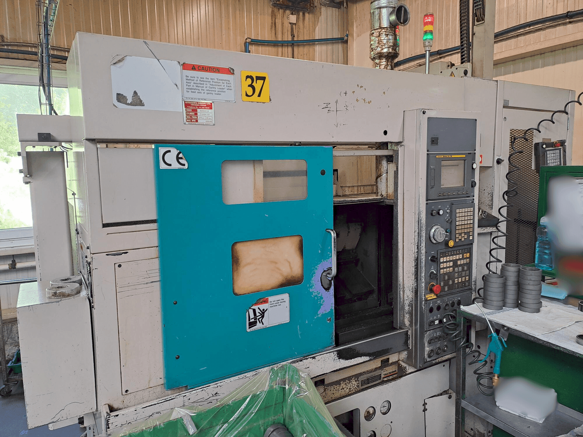 Koneen Takisawa TC 200 etunäkymä