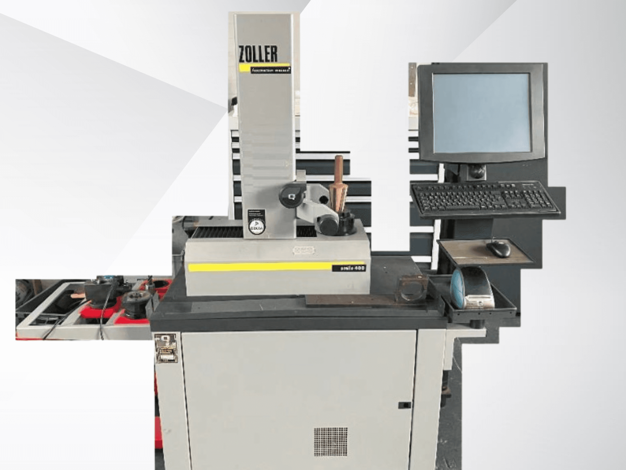 ZOLLER-mittalaite, jossa on tietokonenäyttö, näppäimistö ja työkalut; etukuva, jossa näkyy harmaa väri ja moderni muotoilu.
