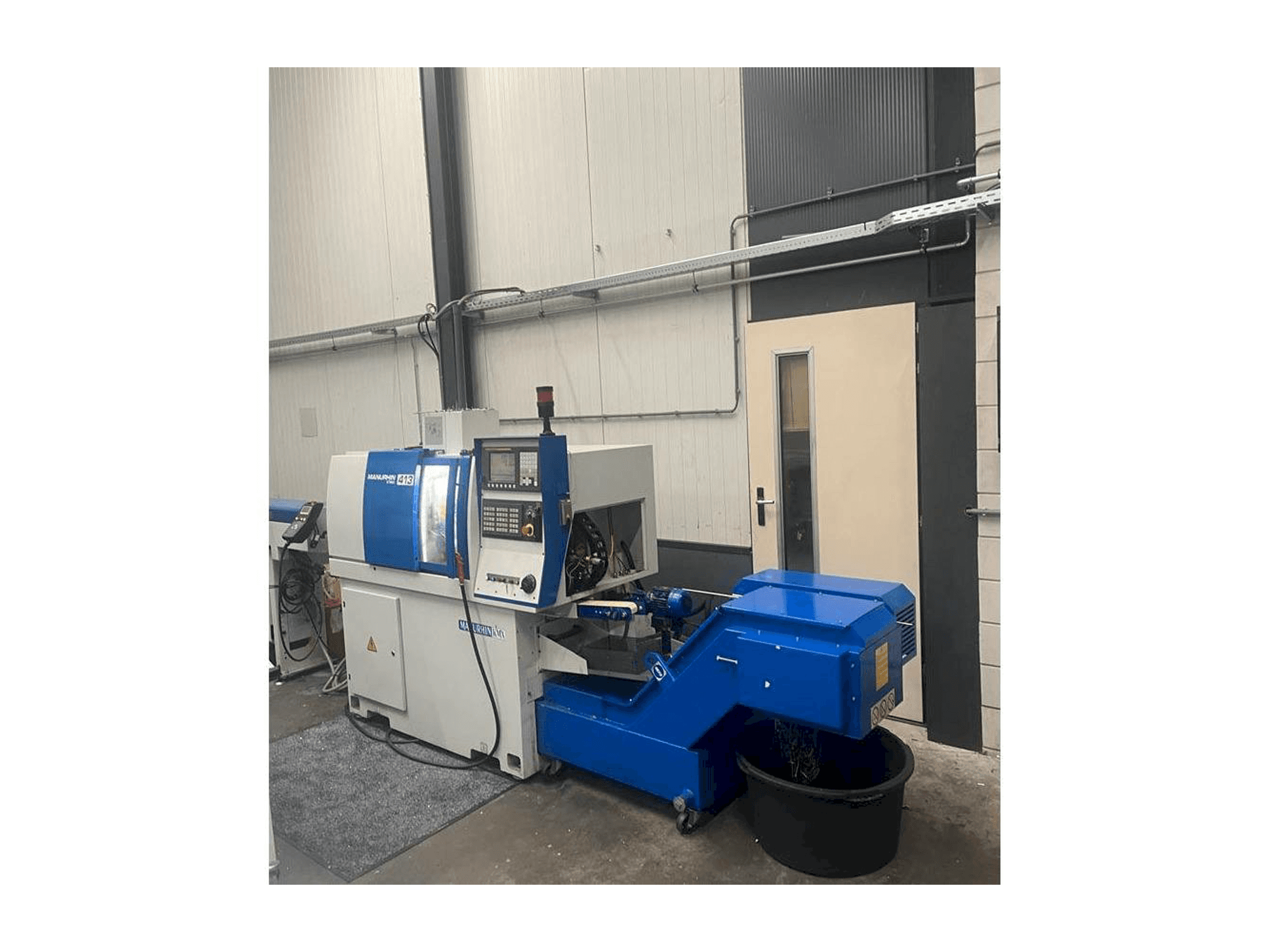 Koneen Manurhin K'MX 413 etunäkymä