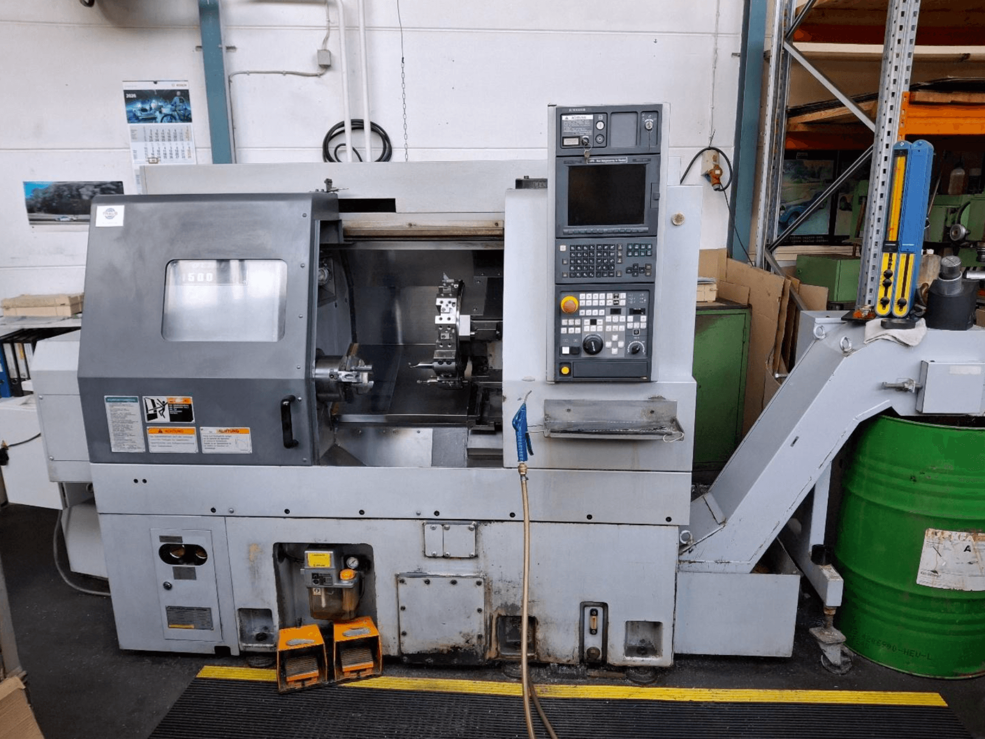 MORI SEIKI CL 1500 T vaakasuuntainen sorvauskone, etukuva, jossa ohjauspaneeli, näkyvät työkalut ja toimintanäyttö.