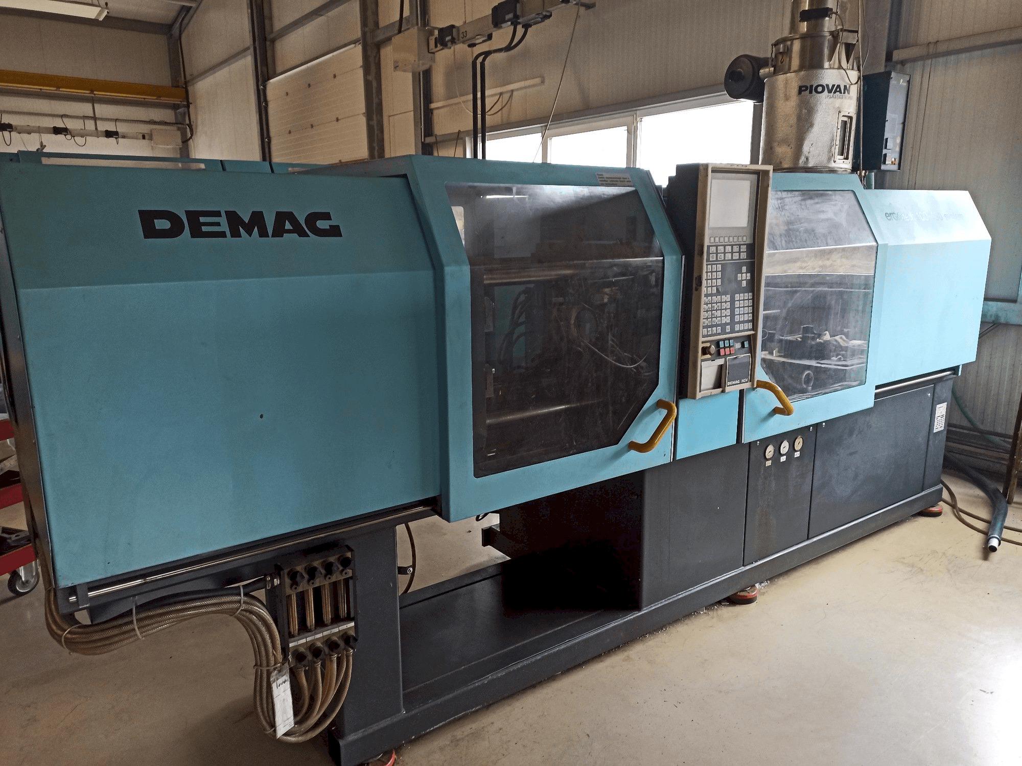 Koneen DEMAG Ergotech 150-610 Compact vasemman sivun näkymä