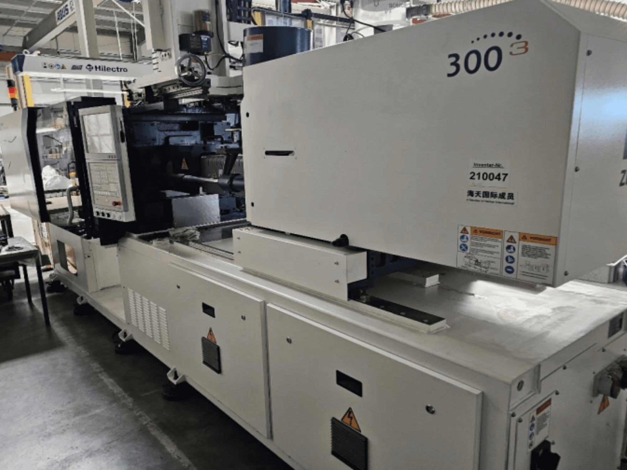 Ruiskuvalukone, merkki Zhenjing, malli 300, etukuva, jossa ohjauspaneeli ja varoituskilvet näkyvissä.