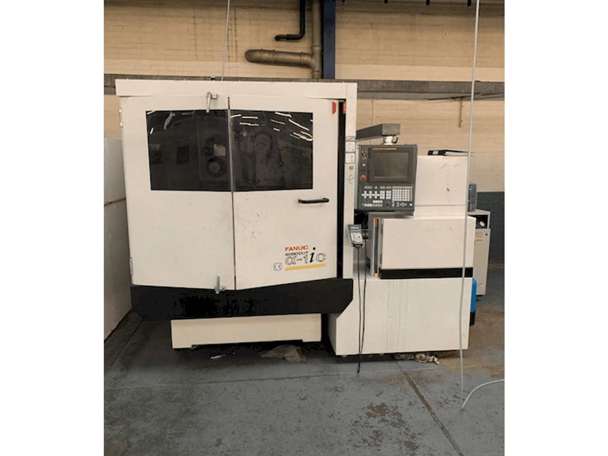 Koneen FANUC ROBOCUT Alpha -1iC S Axis etunäkymä