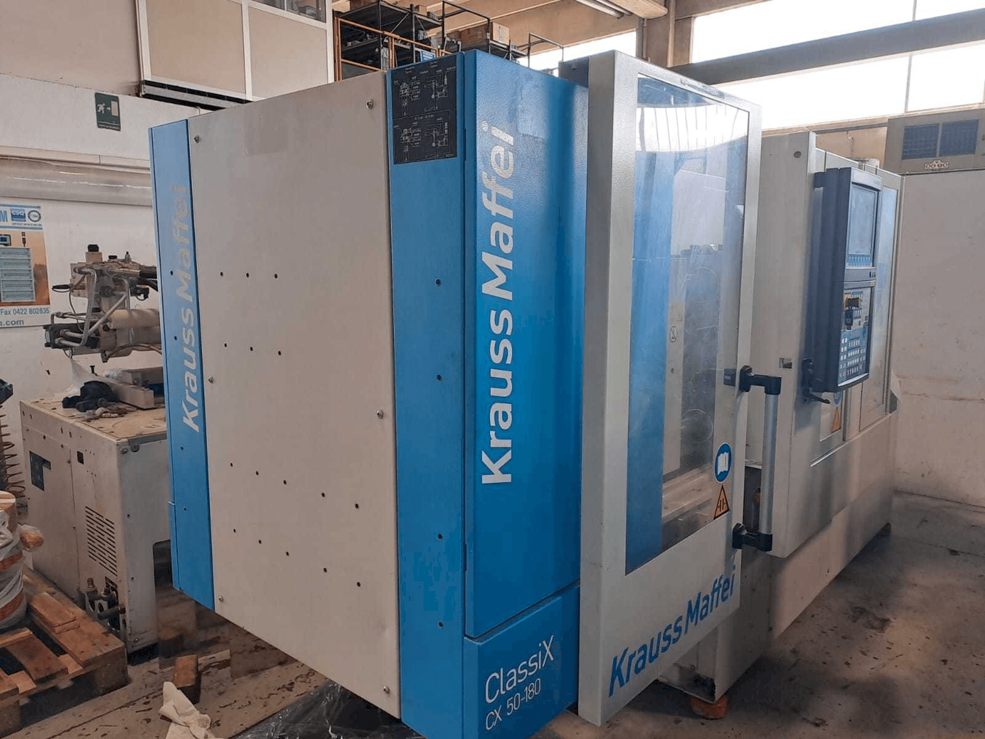 Koneen Krauss Maffei 50-180CX vasen näkymä