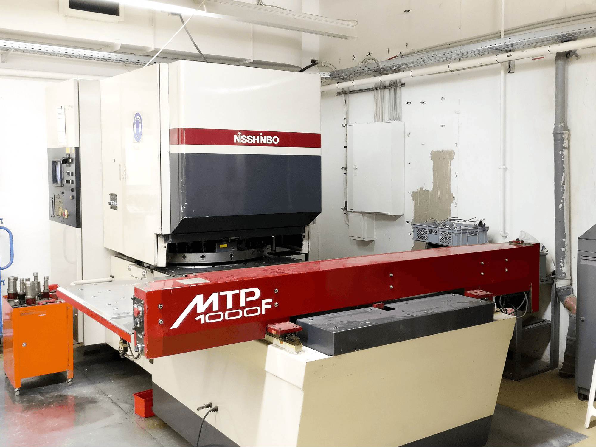 Koneen Nisshinbo MTP-1000F Vasen näkymä